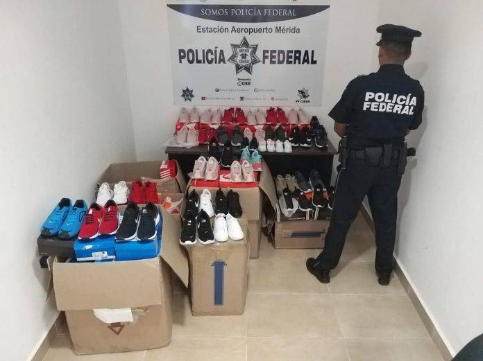 Aseguran buche de totoaba y tenis Nike chafa, en el Aeropuerto de Mérida