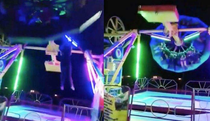 Mujer cae desde un juego mecánico en movimiento (Video)