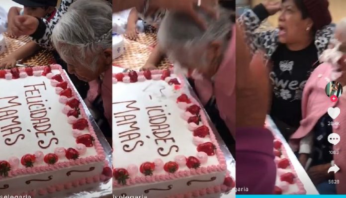 pastel abuelita mordida Empujan a abuelita sobre su pastel del Día de las Madres
